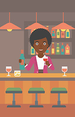 Image showing Bartender standing at the bar counter.