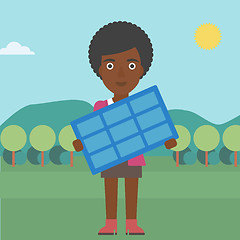 Image showing Woman holding solar panel.