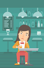 Image showing Woman sitting at bar.