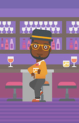 Image showing Man sitting at bar.