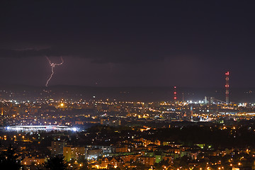Image showing Lightning storm over city at night
