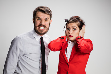 Image showing The business man and woman communicating on a gray background