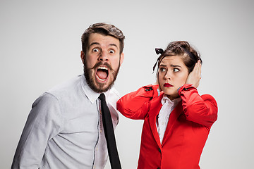 Image showing The business man and woman communicating on a gray background