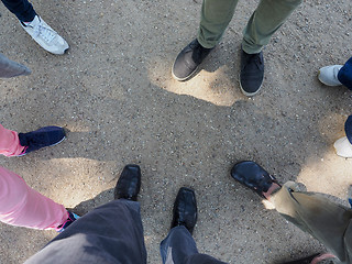 Image showing Three people feet