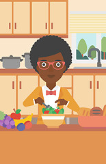 Image showing Woman cooking vegetable salad.