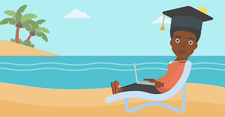 Image showing Graduate lying on chaise lounge with laptop.