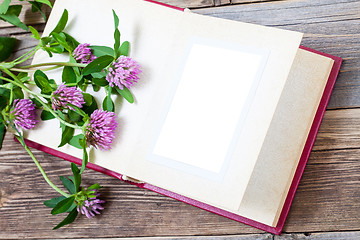 Image showing album with open pages and blossom clover. mock up