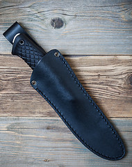 Image showing hunting knife in a leather scabbard