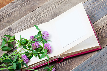 Image showing album and clover flowers with copy space