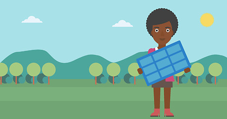 Image showing Woman holding solar panel.