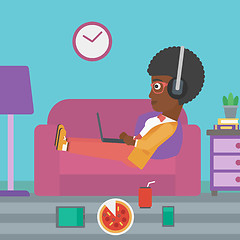 Image showing Woman lying on sofa with many gadgets.