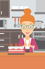 Image showing Woman looking at cake.