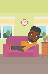 Image showing Man lying on sofa.