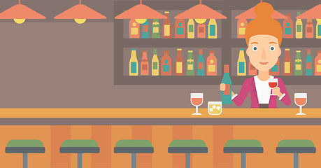 Image showing Bartender standing at the bar counter.