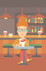 Image showing Woman sitting at bar.