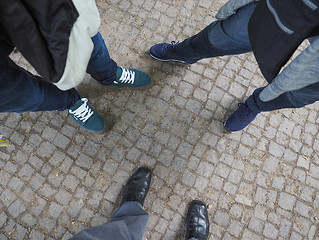 Image showing Three people feet