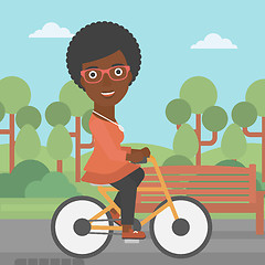 Image showing Woman riding bicycle.