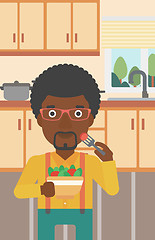 Image showing Man eating salad.