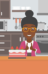 Image showing Woman looking at cake.