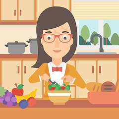 Image showing Woman cooking vegetable salad.