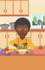Image showing Man cooking vegetable salad.