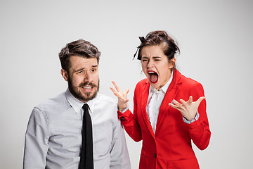 Image showing The business man and woman communicating on a gray background