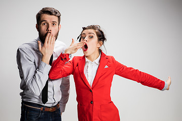 Image showing The yawning business man and woman