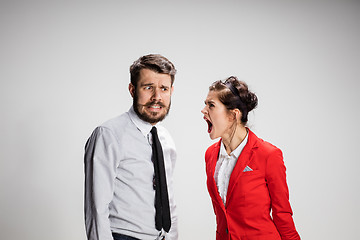 Image showing The business man and woman communicating on a gray background