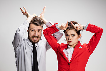 Image showing The business man and woman communicating on a gray background