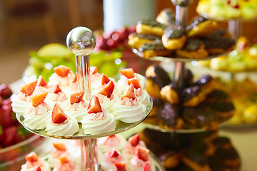 Image showing Dessert table for party. akes and sweetness. Shallow dof