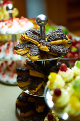 Image showing Dessert table for party. akes and sweetness. Shallow dof