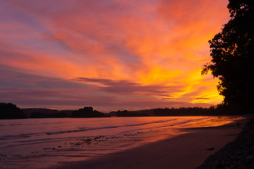 Image showing The sunset over the sea with yellow and orange sky