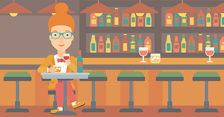 Image showing Woman sitting at bar.