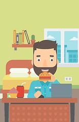 Image showing Man eating hamburger. 