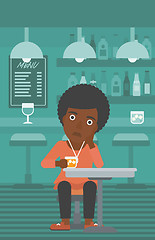 Image showing Woman sitting at bar.