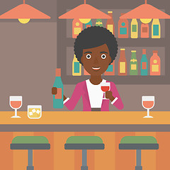 Image showing Bartender standing at the bar counter.