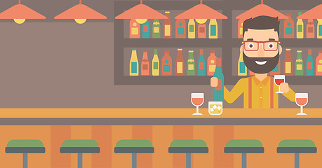 Image showing Bartender standing at the bar counter.