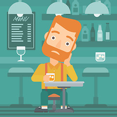 Image showing Man sitting at bar.