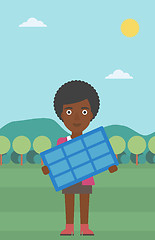 Image showing Woman holding solar panel.