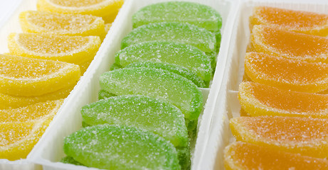 Image showing colourful fruit candies in boxes