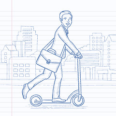 Image showing Man riding on scooter.