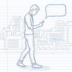 Image showing Man walking with smartphone.