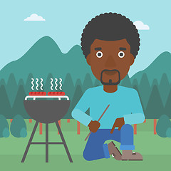 Image showing Man preparing barbecue.