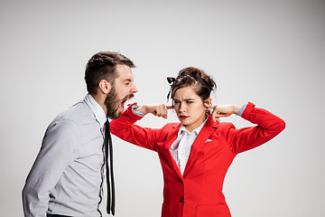 Image showing The business man and woman communicating on a gray background