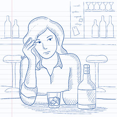 Image showing Woman sitting at bar.