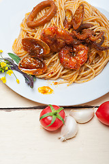 Image showing Italian seafood spaghetti pasta on red tomato sauce 