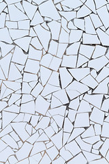 Image showing White broken tiles wall