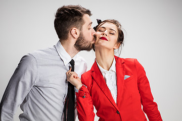 Image showing The business man and woman communicating on a gray background