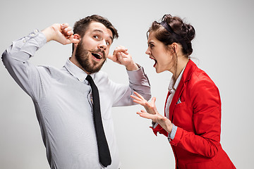 Image showing The business man and woman communicating on a gray background