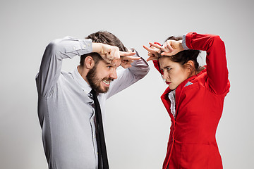 Image showing The business man and woman communicating on a gray background